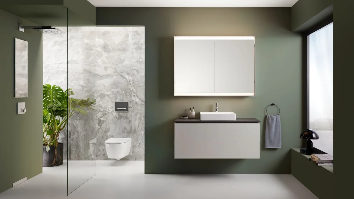 Salle de bains Geberit ONE avec meuble suspendu, miroir et douche.